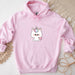 a pink hoodie with a cartoon unicorn on it