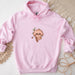 a pink hoodie with a picture of a slotty on it