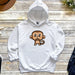 a white hoodie with a cartoon monkey on it