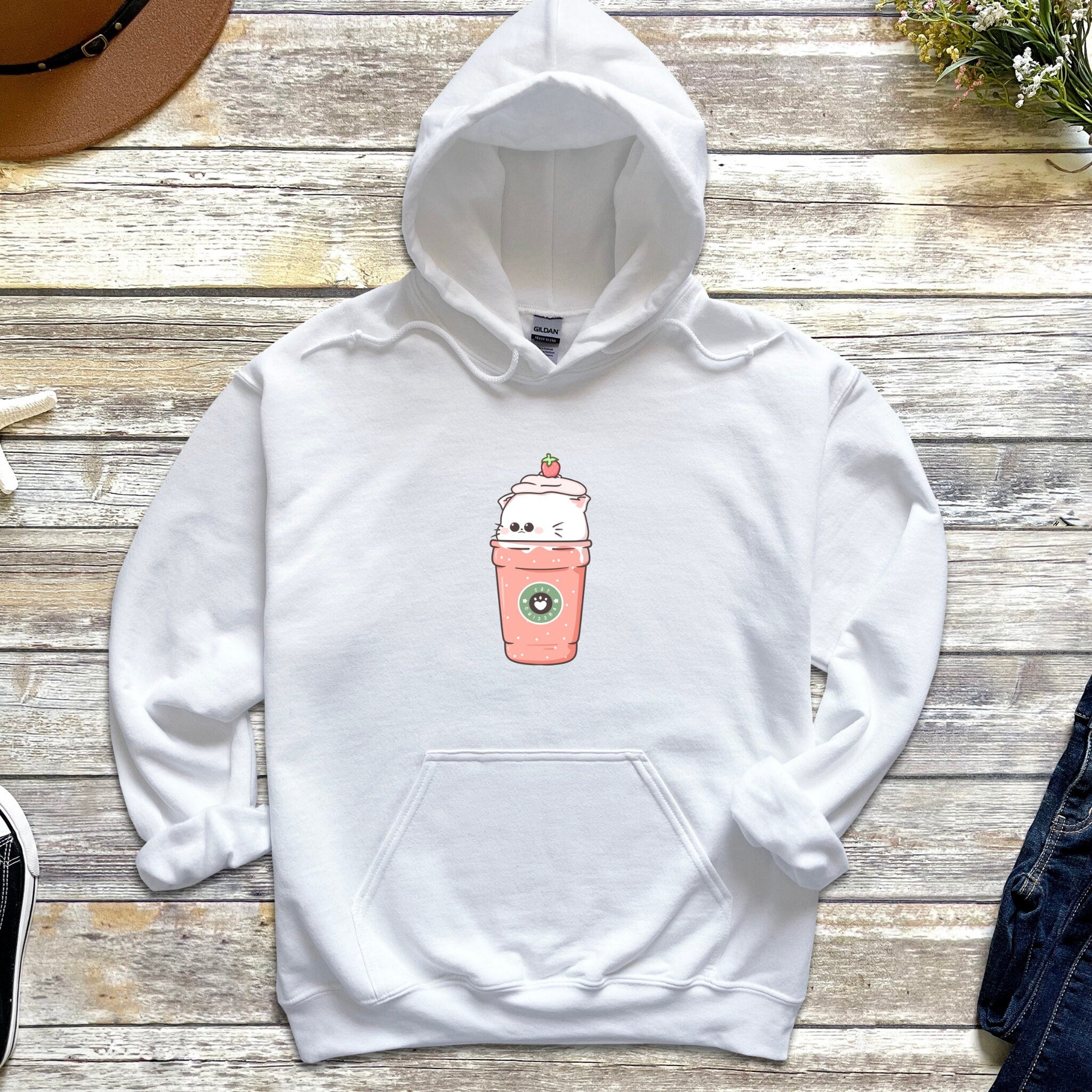 a white hoodie with a coffee cup drawn on it