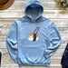 a blue hoodie with a picture of a cat holding chopsticks