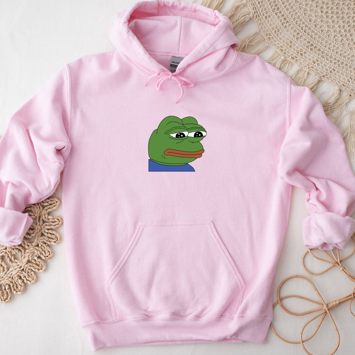 a pink hoodie with a picture of a frog on it