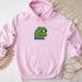 a pink hoodie with a picture of a frog on it