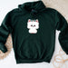 a green sweatshirt with a white dog on it
