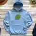 a blue hoodie with a cartoon frog on it