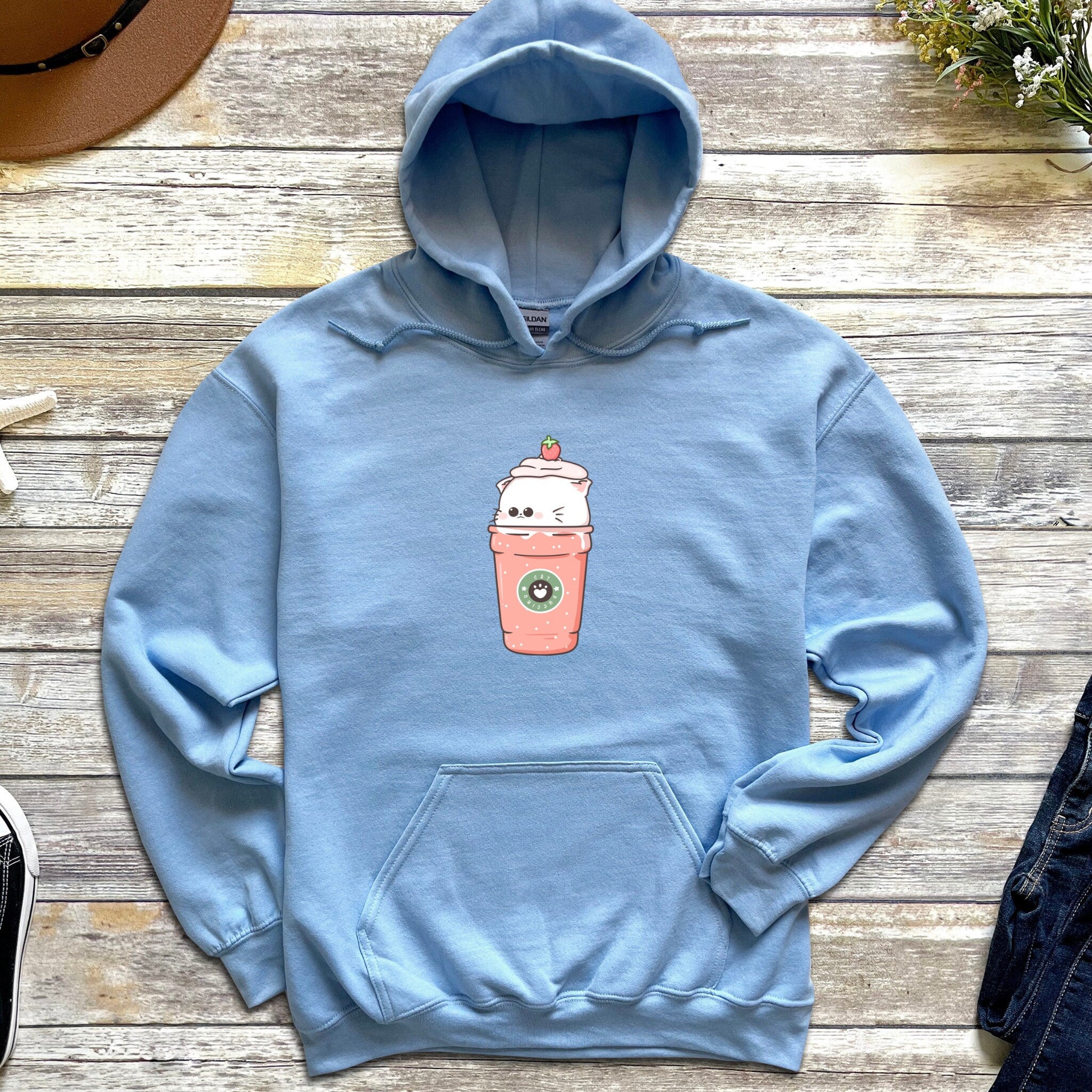 a blue hoodie with a picture of a coffee cup on it