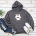 a sweatshirt with a unicorn on it next to a pair of jeans