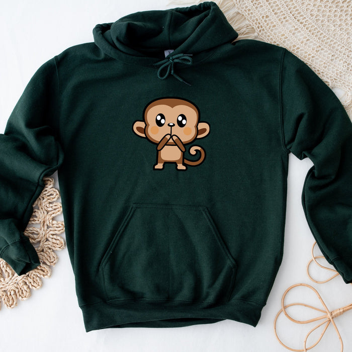 a green sweatshirt with a cartoon monkey on it