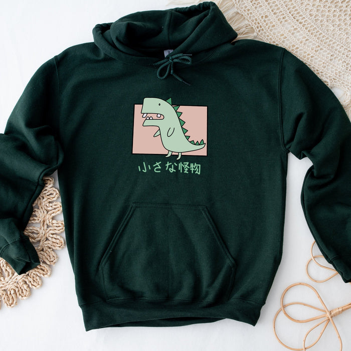 a green hoodie with a picture of a dinosaur on it