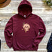 a maroon hoodie with a slot on it