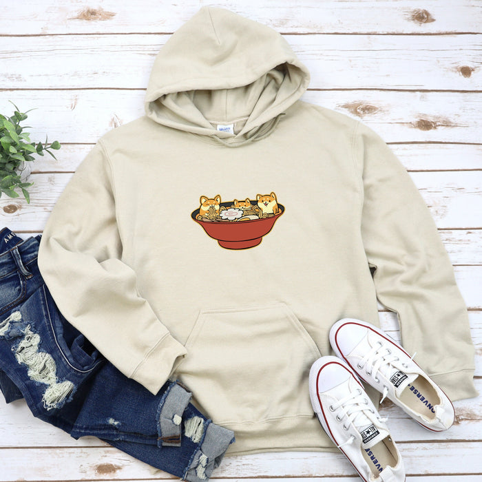 a sweatshirt with a picture of three cats in a bowl on it