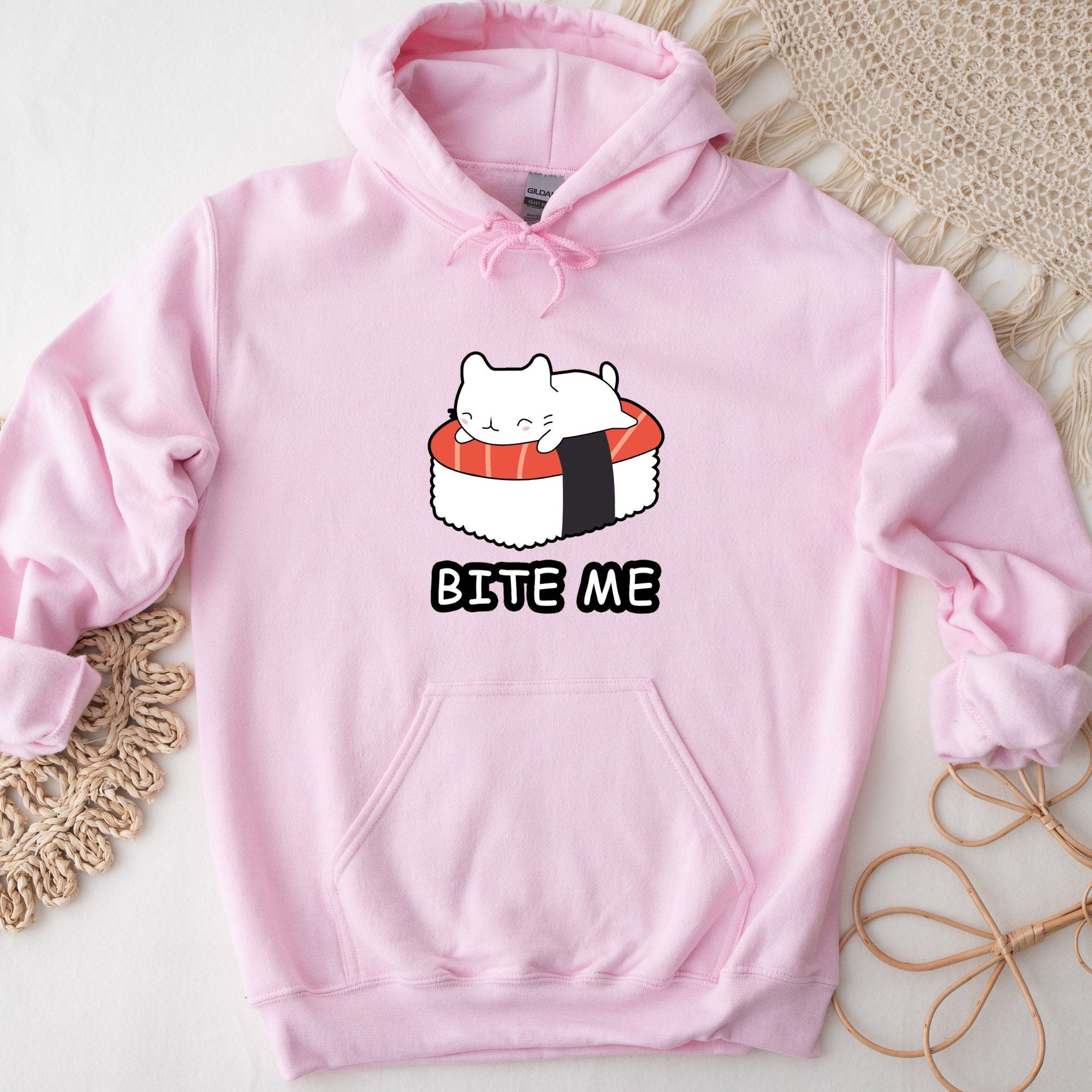 a pink sweatshirt with a sushi cat on it