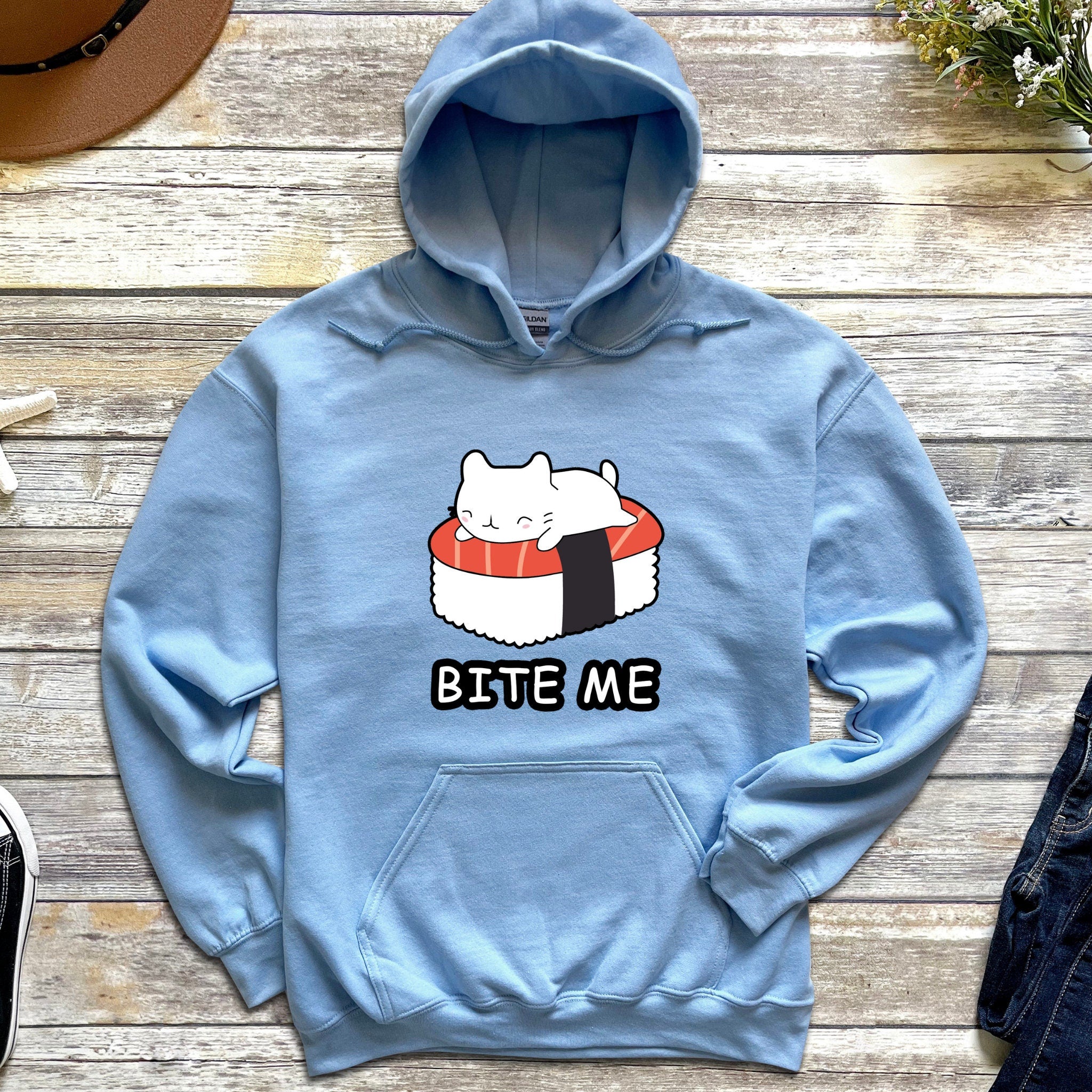 a blue sweatshirt with a sushi cat on it