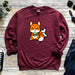 a red sweatshirt with a cartoon fox eating an apple