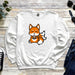 a white sweatshirt with a cartoon fox on it