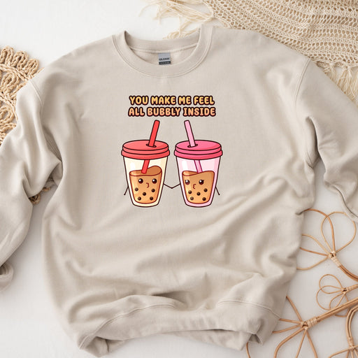 a sweatshirt with two cups of iced coffee on it