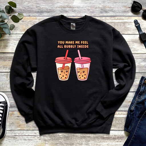 a black sweater with two cups of coffee on it