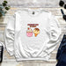a white sweatshirt with an ice cream and a donut on it