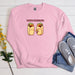 a pink sweatshirt with two burritos on it