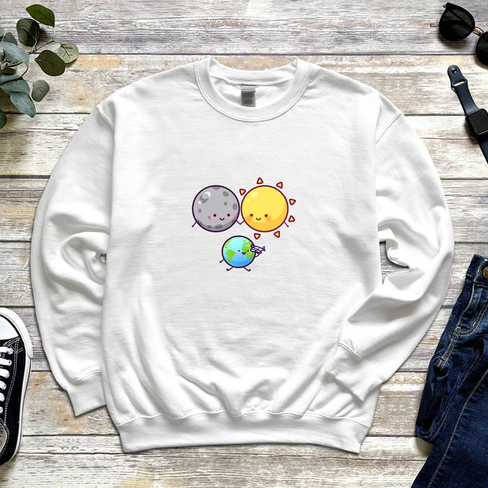 a white sweatshirt with the sun and moon on it