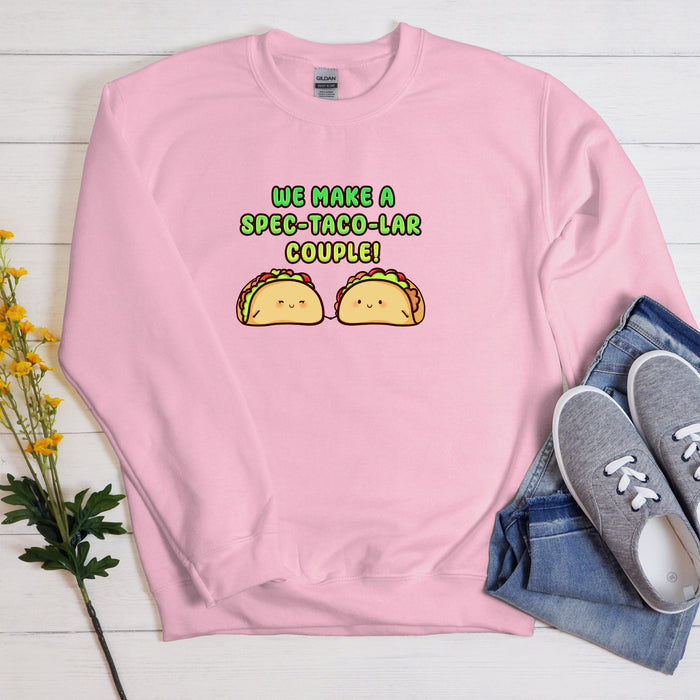 a pink sweatshirt with two tacos on it