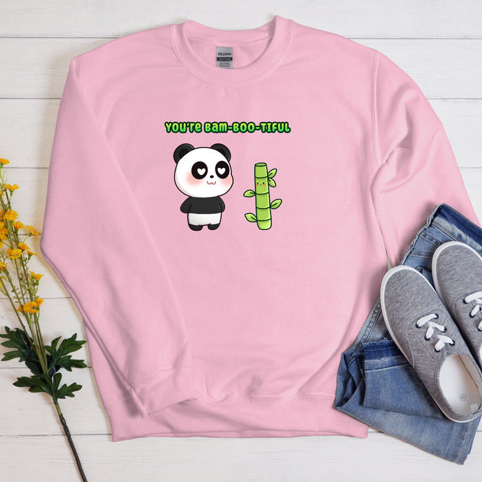 a pink sweatshirt with a panda holding a cactus