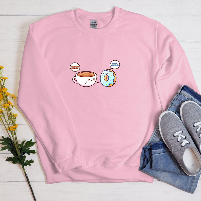 a pink sweatshirt with two donuts and a cup of coffee