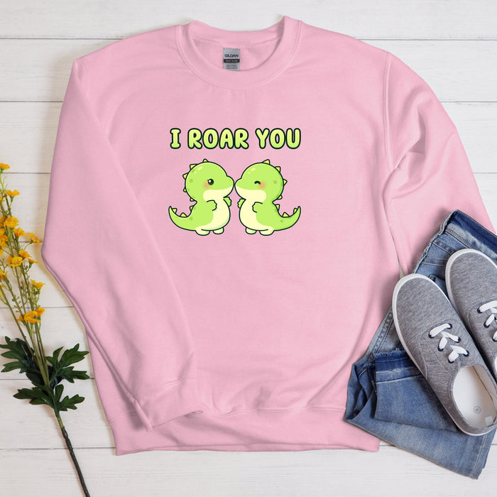 a pink sweatshirt with the words i roar you printed on it