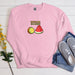 a pink sweatshirt with a watermelon and kiwi on it