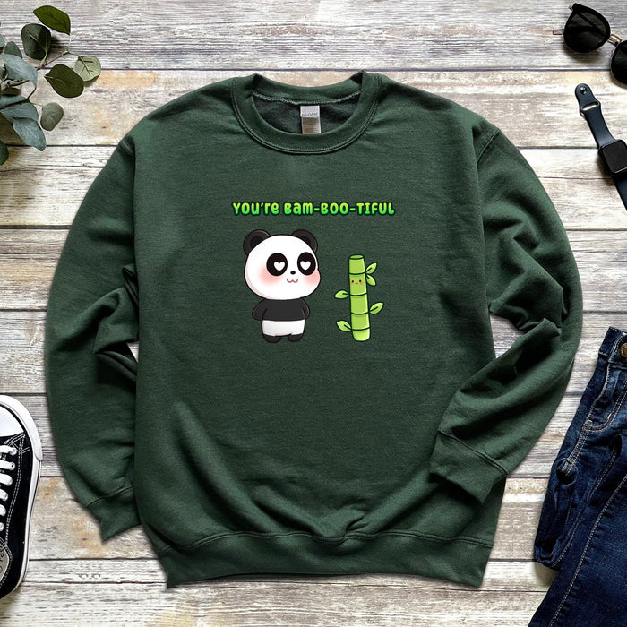 a green sweater with a panda holding a bamboo plant