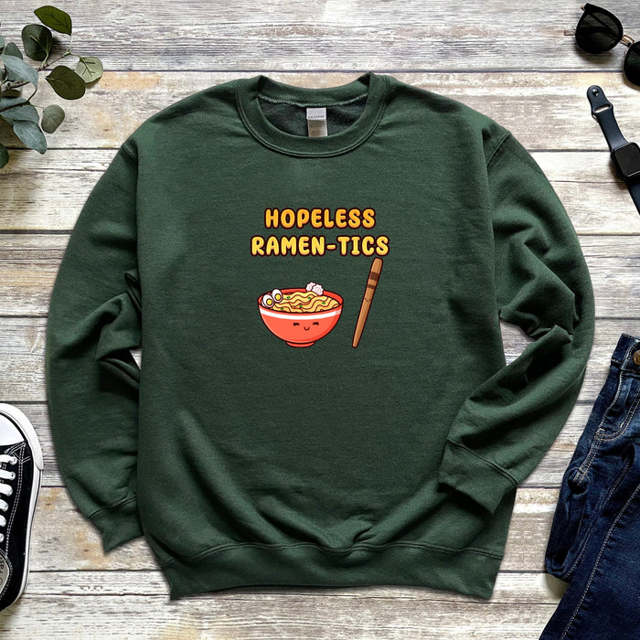 a green sweatshirt with a bowl of ramen and chopsticks on it