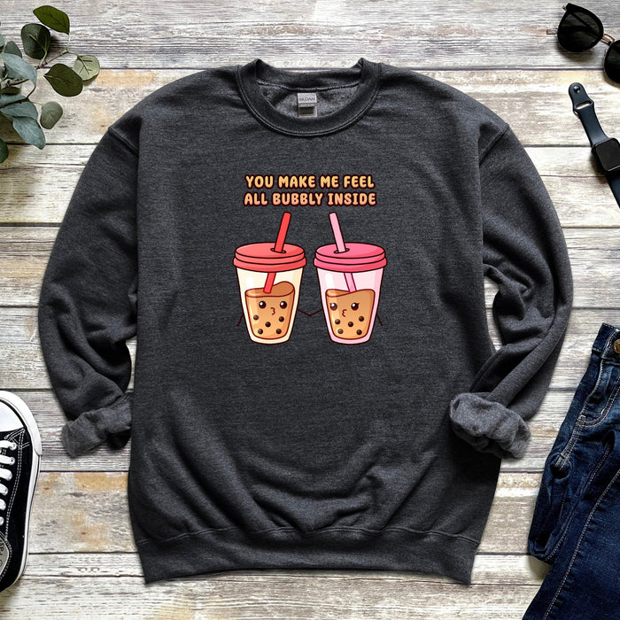 a sweater with two cups of coffee on it