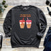 a sweater with two cups of coffee on it