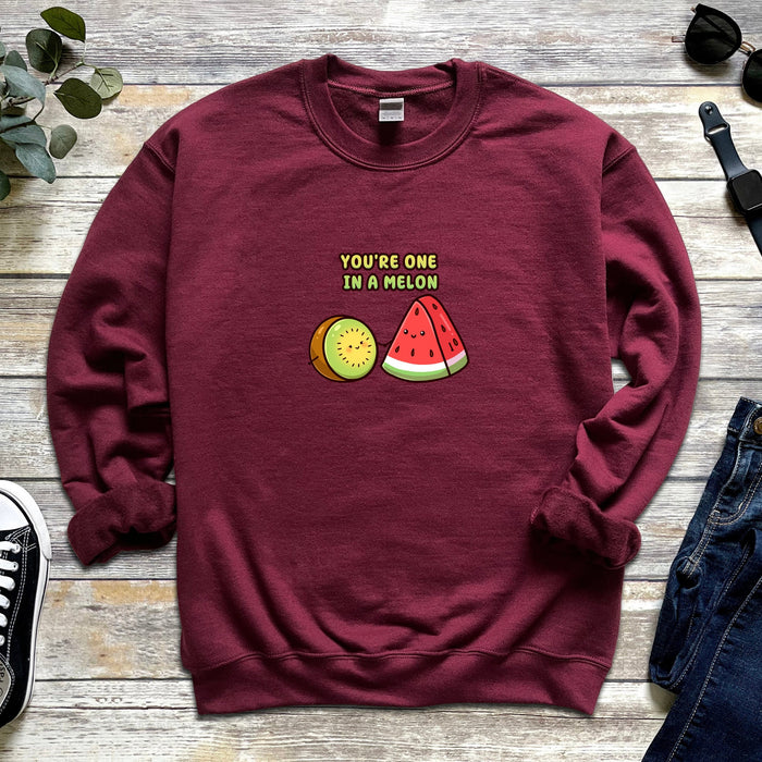 a sweatshirt with a watermelon and a slice of watermelon on it