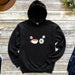 a black hoodie with an image of coffee and donuts on it