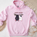 a pink hoodie with a picture of a dog hanging from a tree