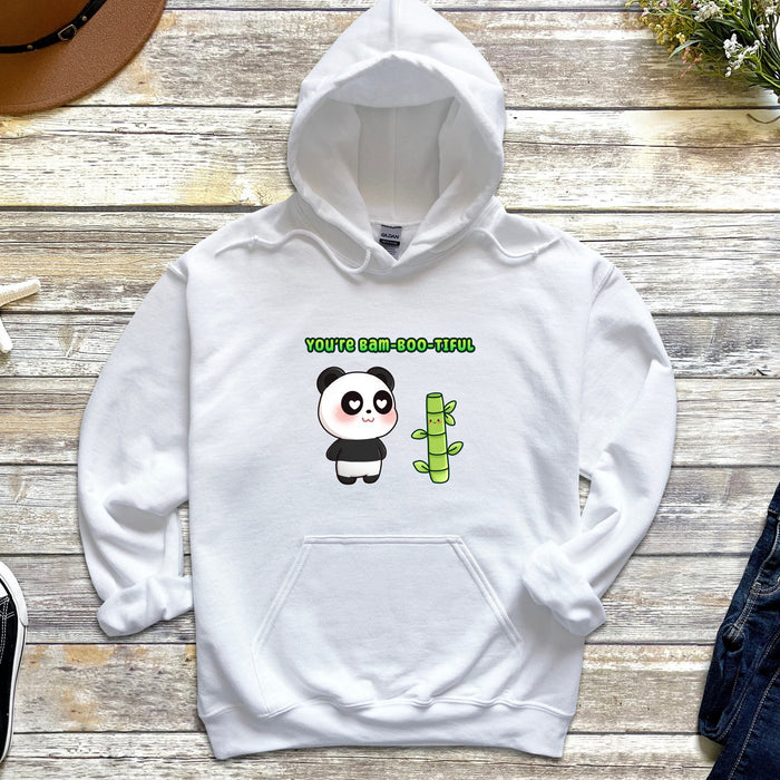 a white hoodie with a panda holding a cactus
