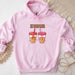 a pink hoodie with two cups of coffee on it