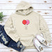 a hoodie with a balloon drawn on it