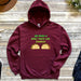 a maroon hoodie that says we make a speech taco - lar couple