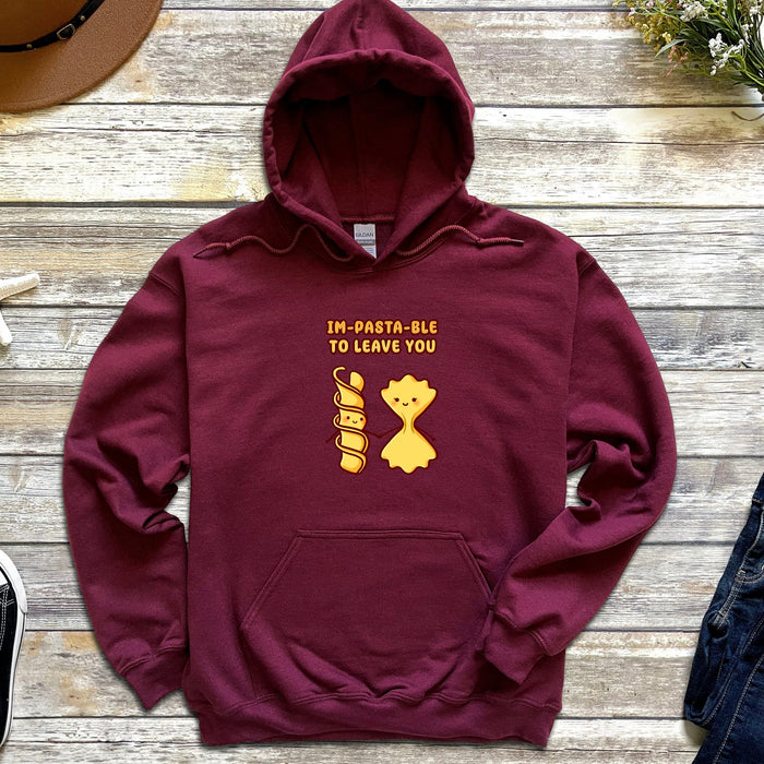 a maroon hoodie with the words in arabic and a picture of a cat on