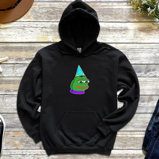 a black hoodie with a green frog wearing a party hat