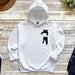 a white hoodie with a black cat on it