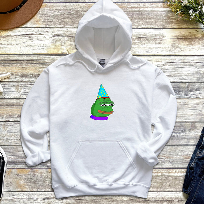 a white hoodie with a cartoon of a frog wearing a party hat