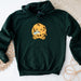a green hoodie with a picture of a cookie monster on it