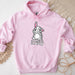 a pink hoodie with a cartoon bunny on it