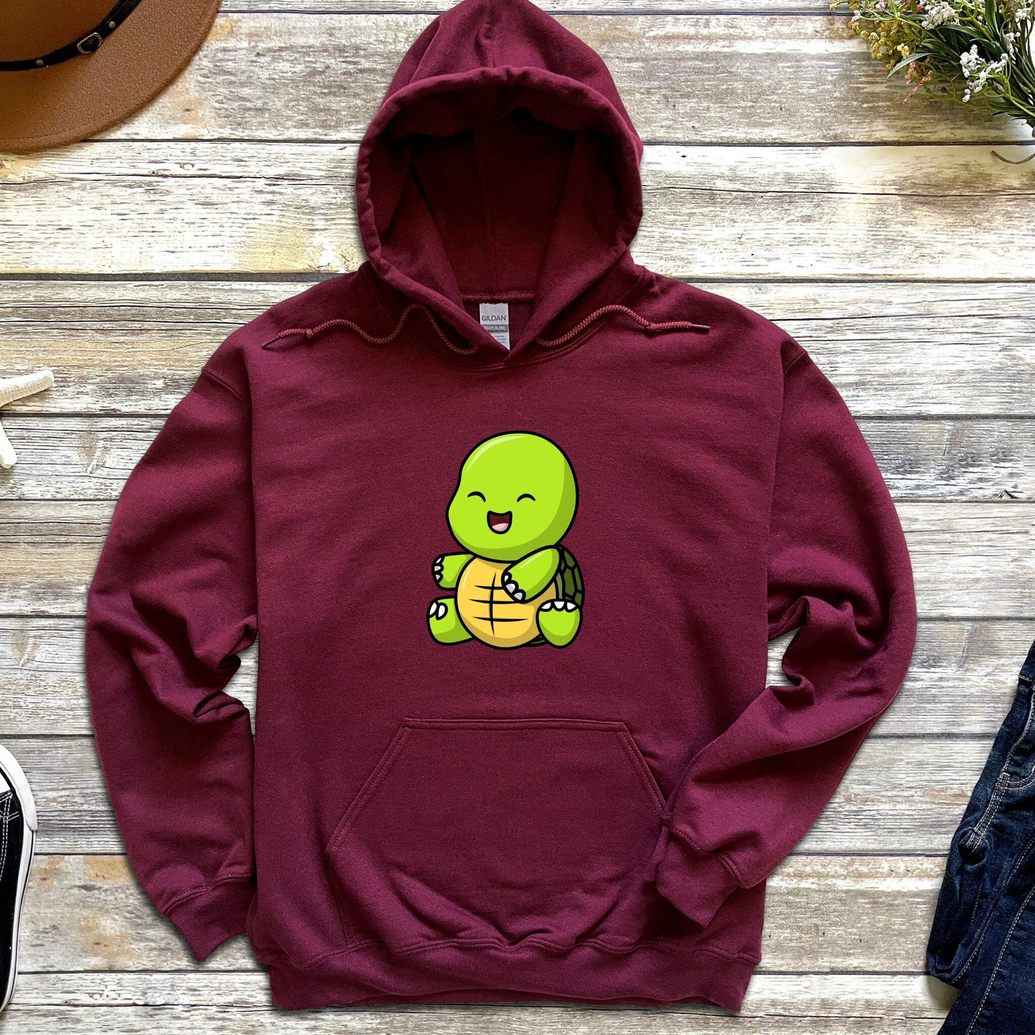 a red hoodie with a cartoon turtle on it