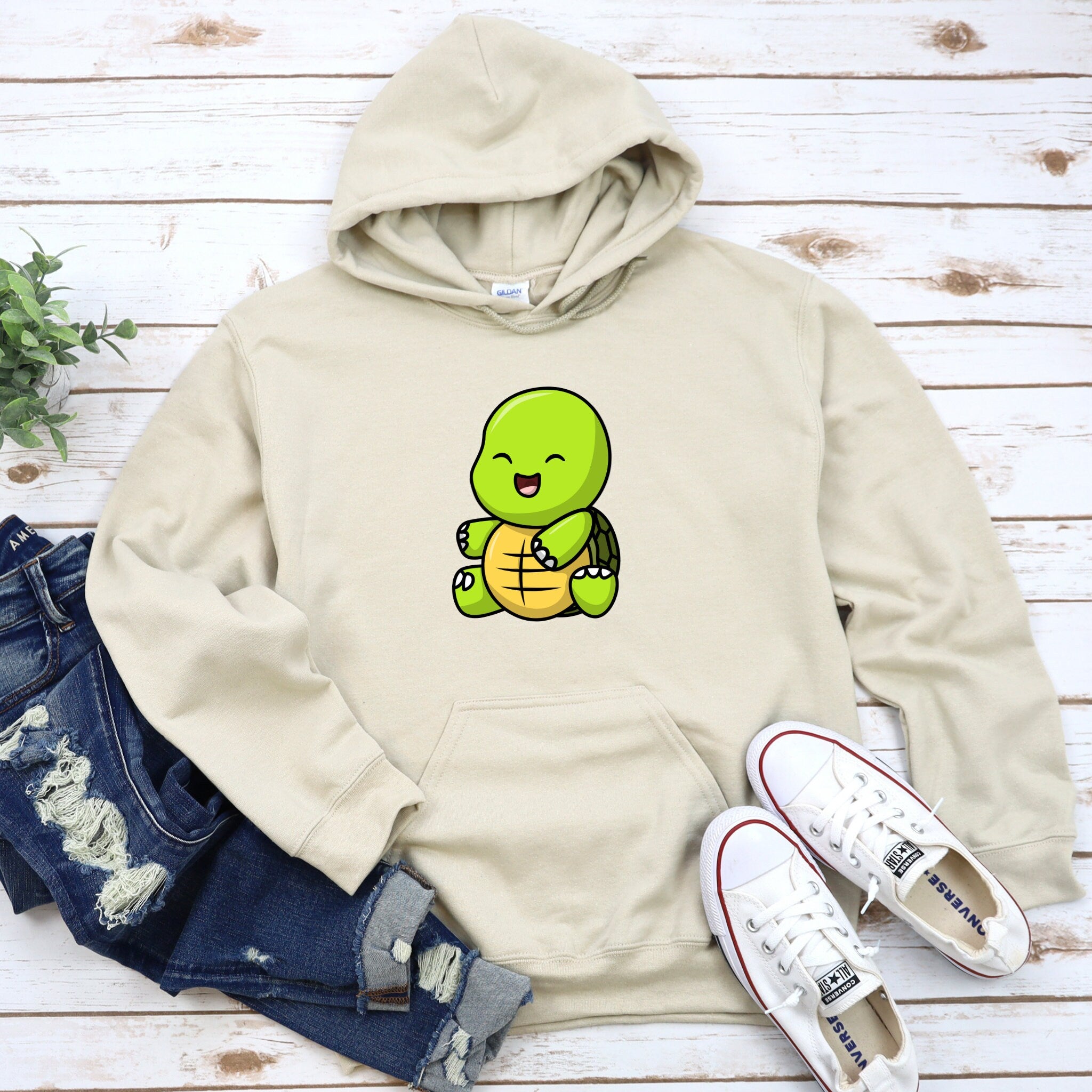 a white hoodie with a cartoon character on it
