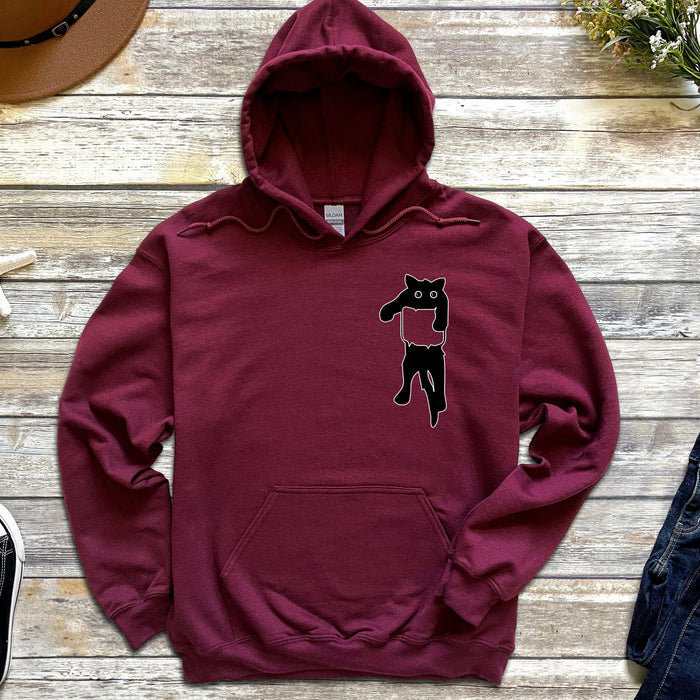a maroon hoodie with a black cat on it