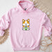 a pink hoodie with a cartoon cat holding a cup of coffee